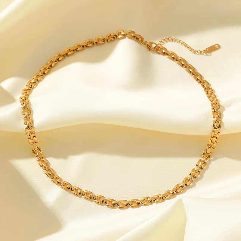 Gouden geometrische ketting en armband set