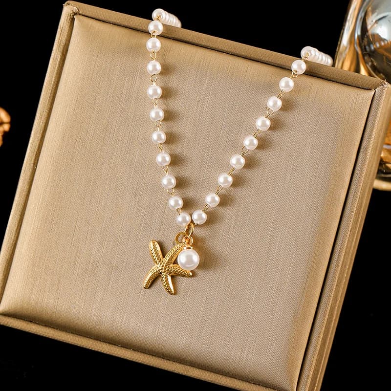 Roestvrijstalen hangerketting met zon, zeester en schelp