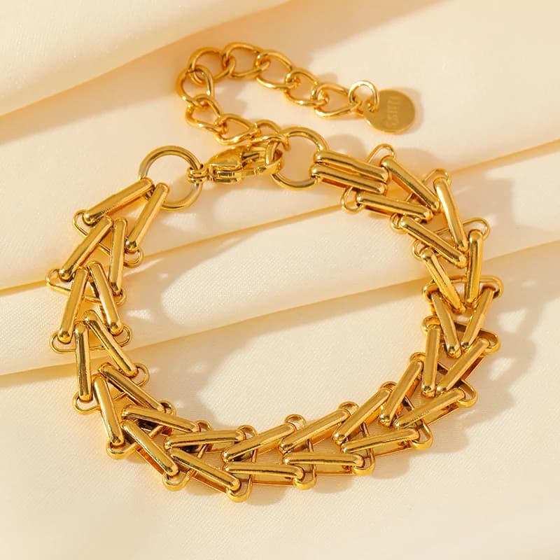 Dikke geometrische schakelarmband, goud verguld