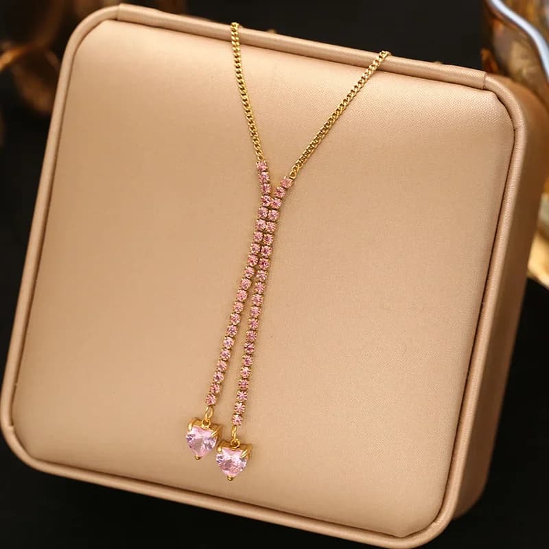 Lange hangerketting met roze zirkoon, verguld