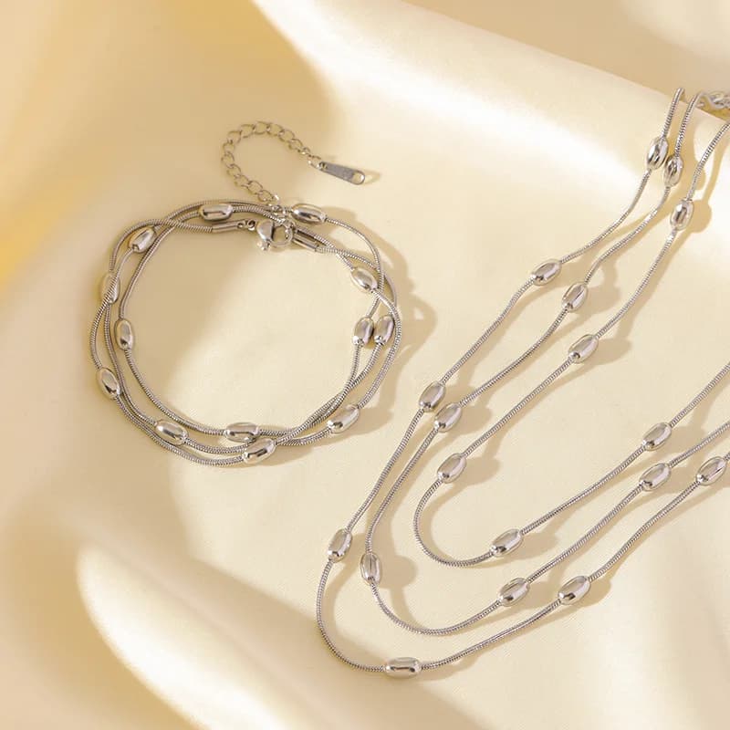 Gouden meerlaags stapelketting armband set